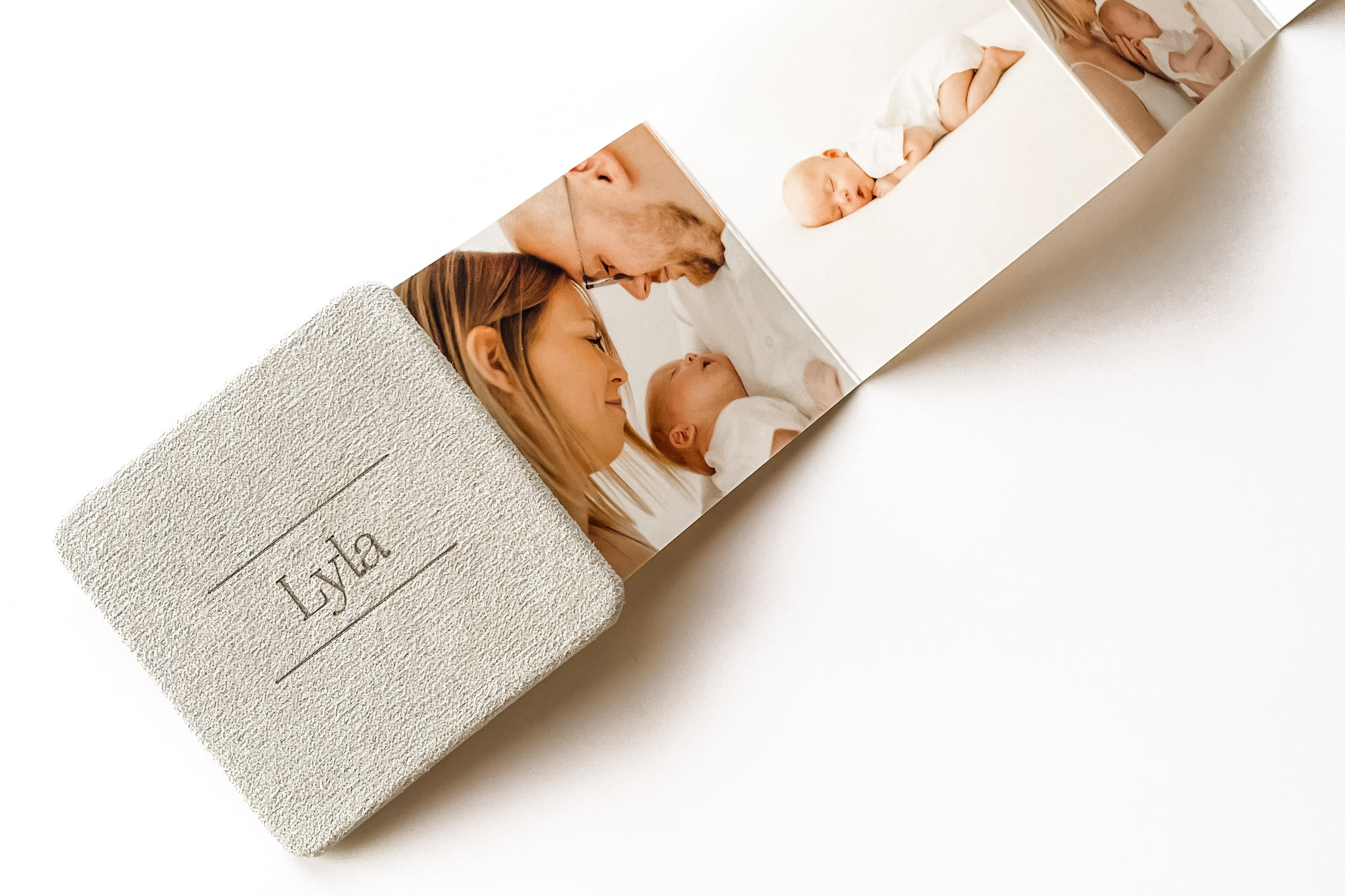 Mini book of photos of newborn baby photoshoot in colchester